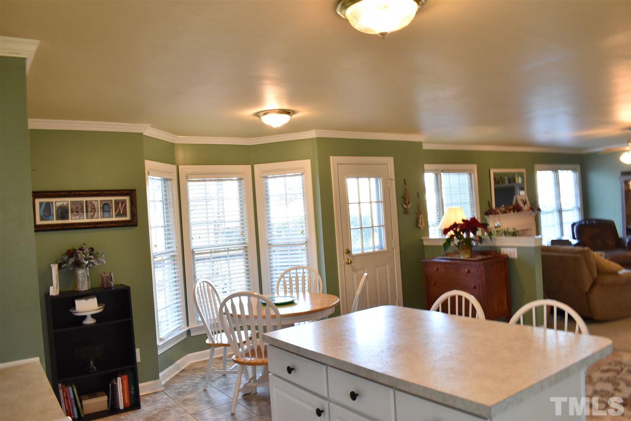 4629 Mill Rock Lane Raleigh, NC 27616 - Photo 9 of 30 a living room with furniture and floor to ceiling window