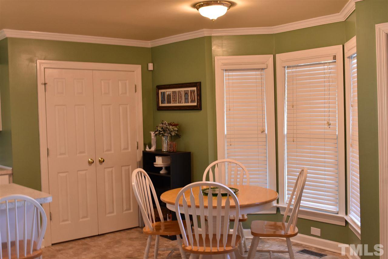 4629 Mill Rock Lane Raleigh, NC 27616 - Photo 10 of 30 a view of a dining room with furniture and window