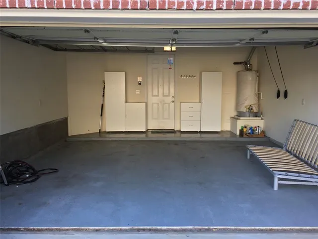 a view of a house with backyard sitting area and swimming pool