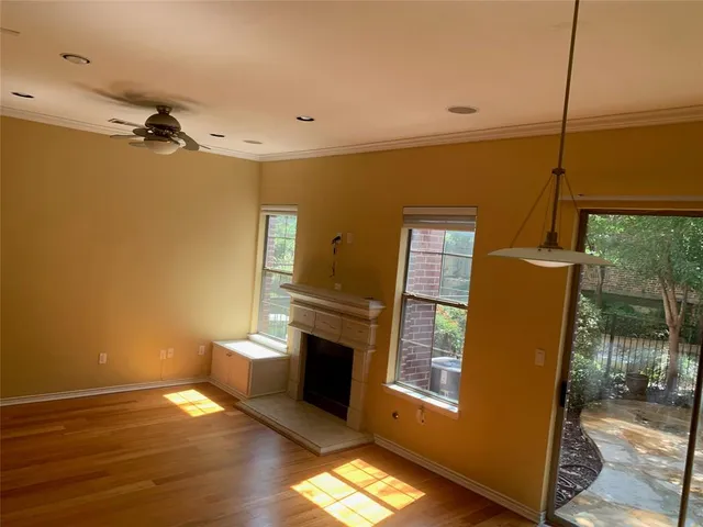 a view of a livingroom with furniture and wooden floor
