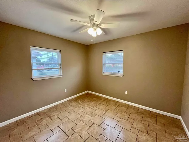a view of a livingroom with a chandelier fan