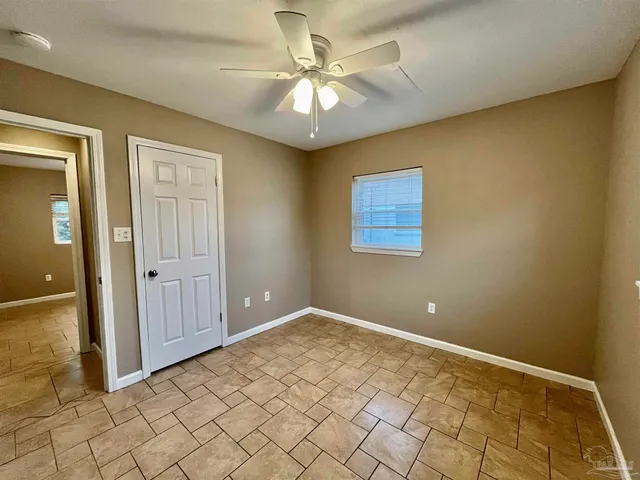 a view of a livingroom with a chandelier fan