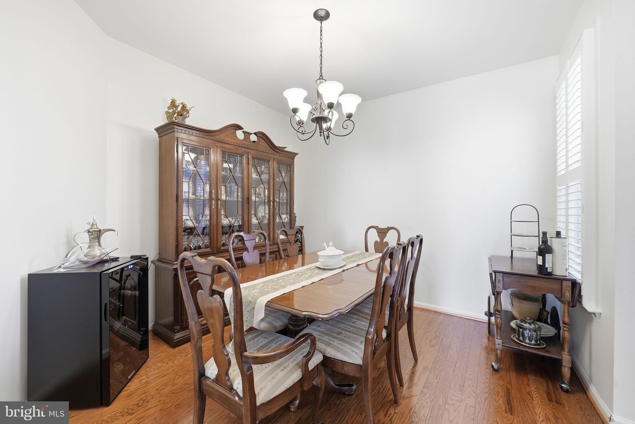 6828 Derby Run Way Gainesville, VA 20155 - Photo 13 of 30 Elegant dining space with warm tones.