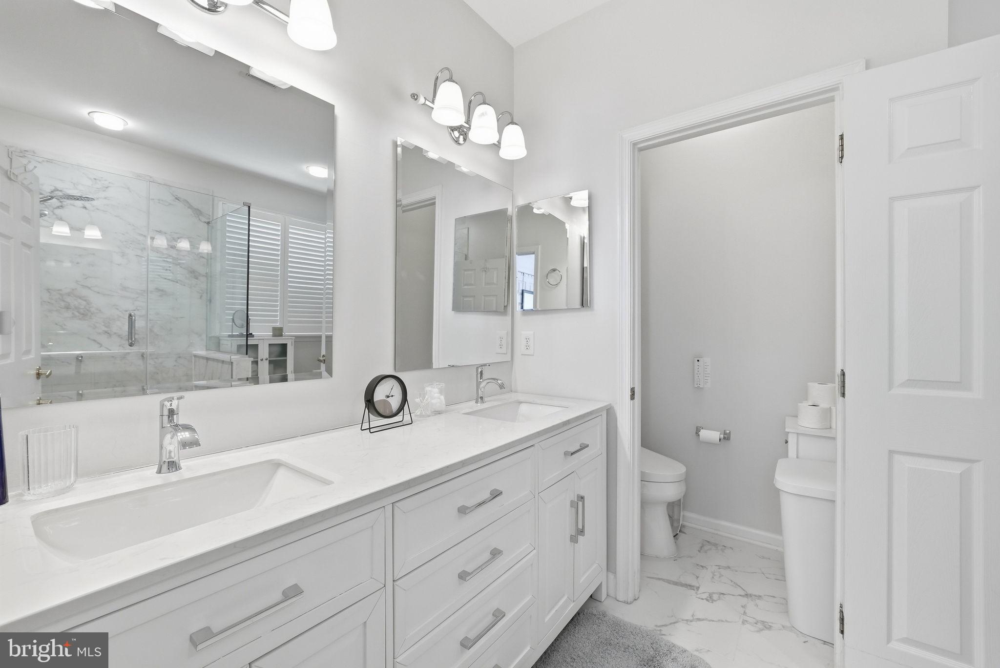 6828 Derby Run Way Gainesville, VA 20155 - Photo 14 of 30 Sleek and modern bathroom oasis.