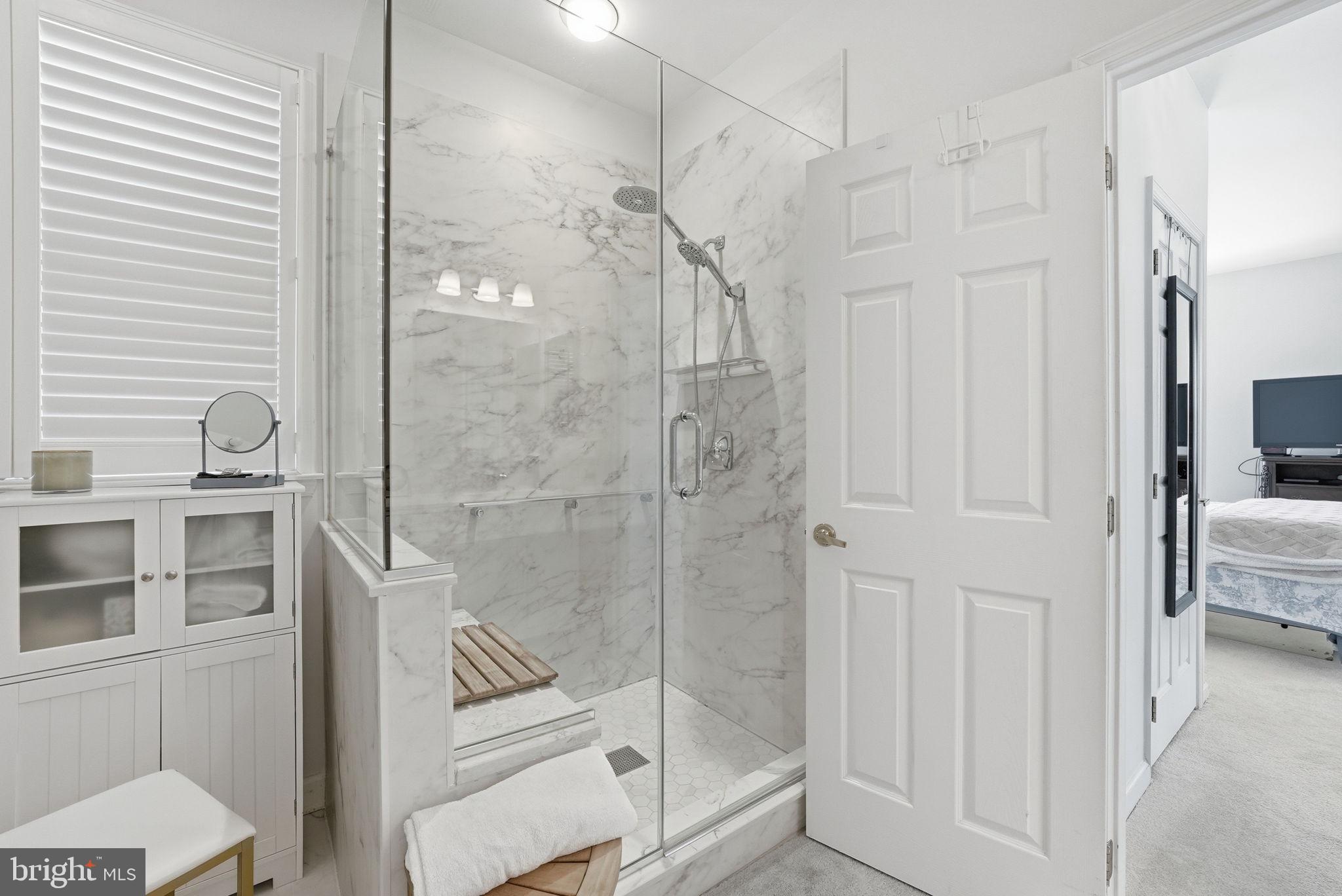 6828 Derby Run Way Gainesville, VA 20155 - Photo 15 of 30 Sleek marble shower in modern bath.