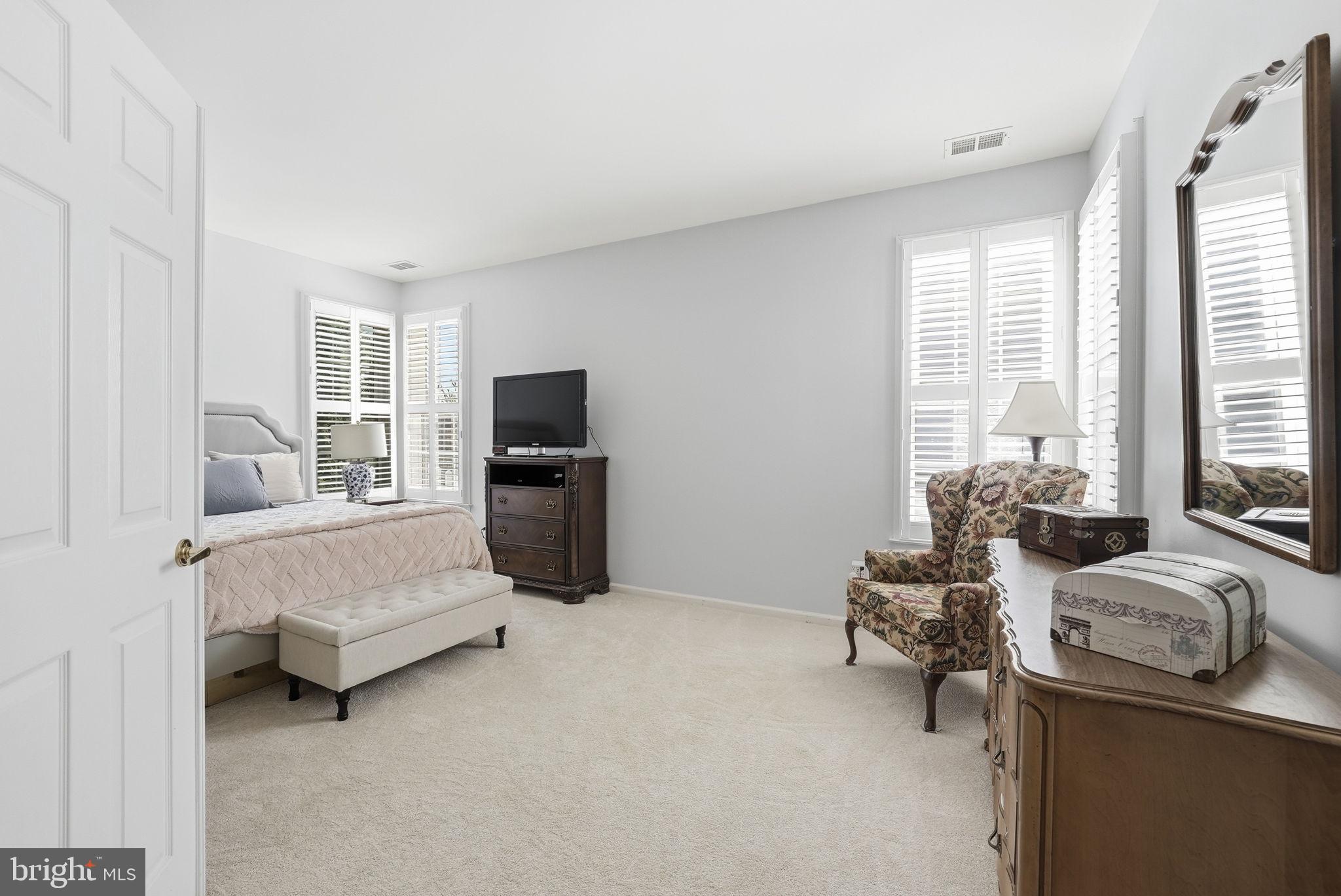 6828 Derby Run Way Gainesville, VA 20155 - Photo 16 of 30 Serene bedroom with natural light.