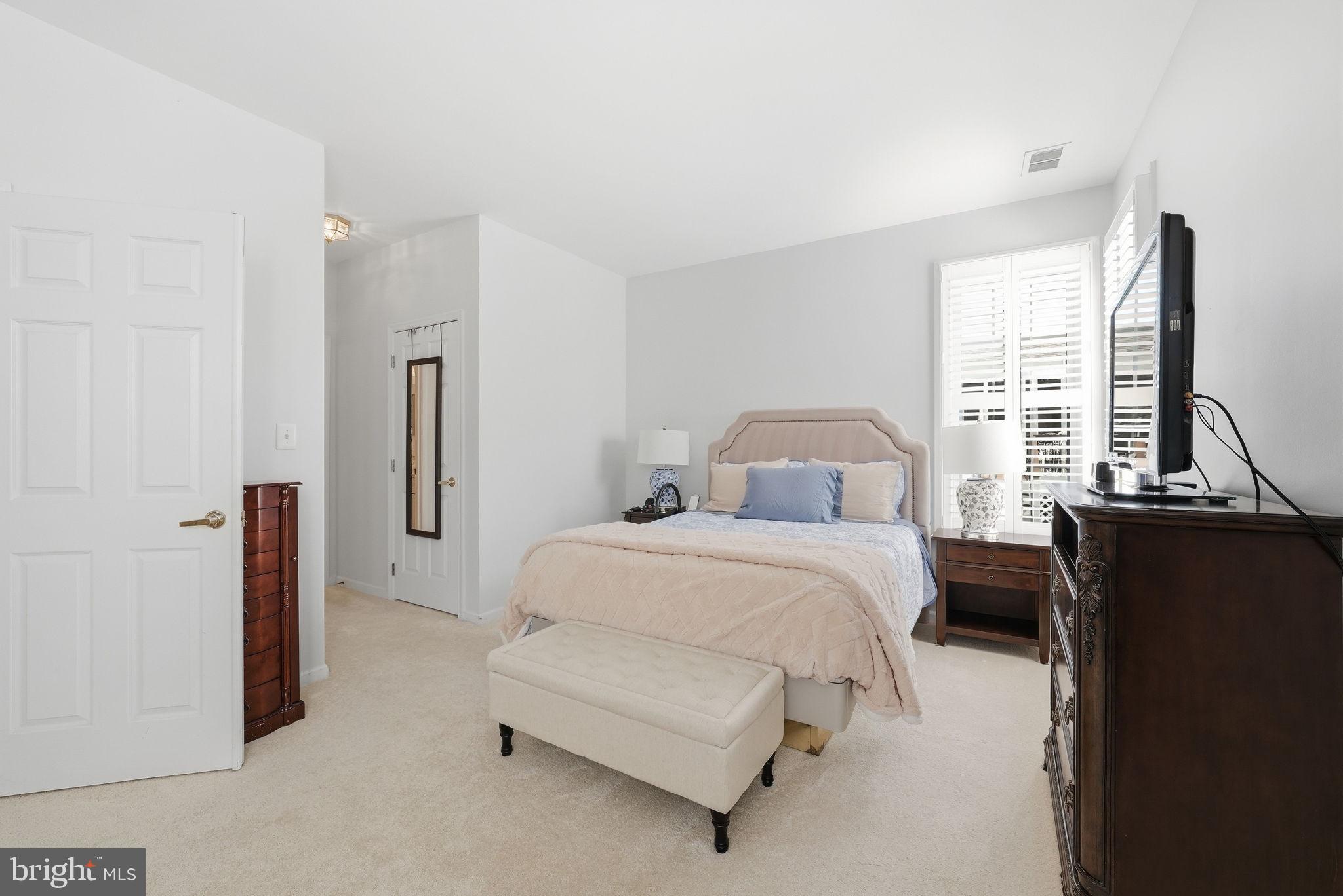 6828 Derby Run Way Gainesville, VA 20155 - Photo 17 of 30 Serene bedroom with natural light.