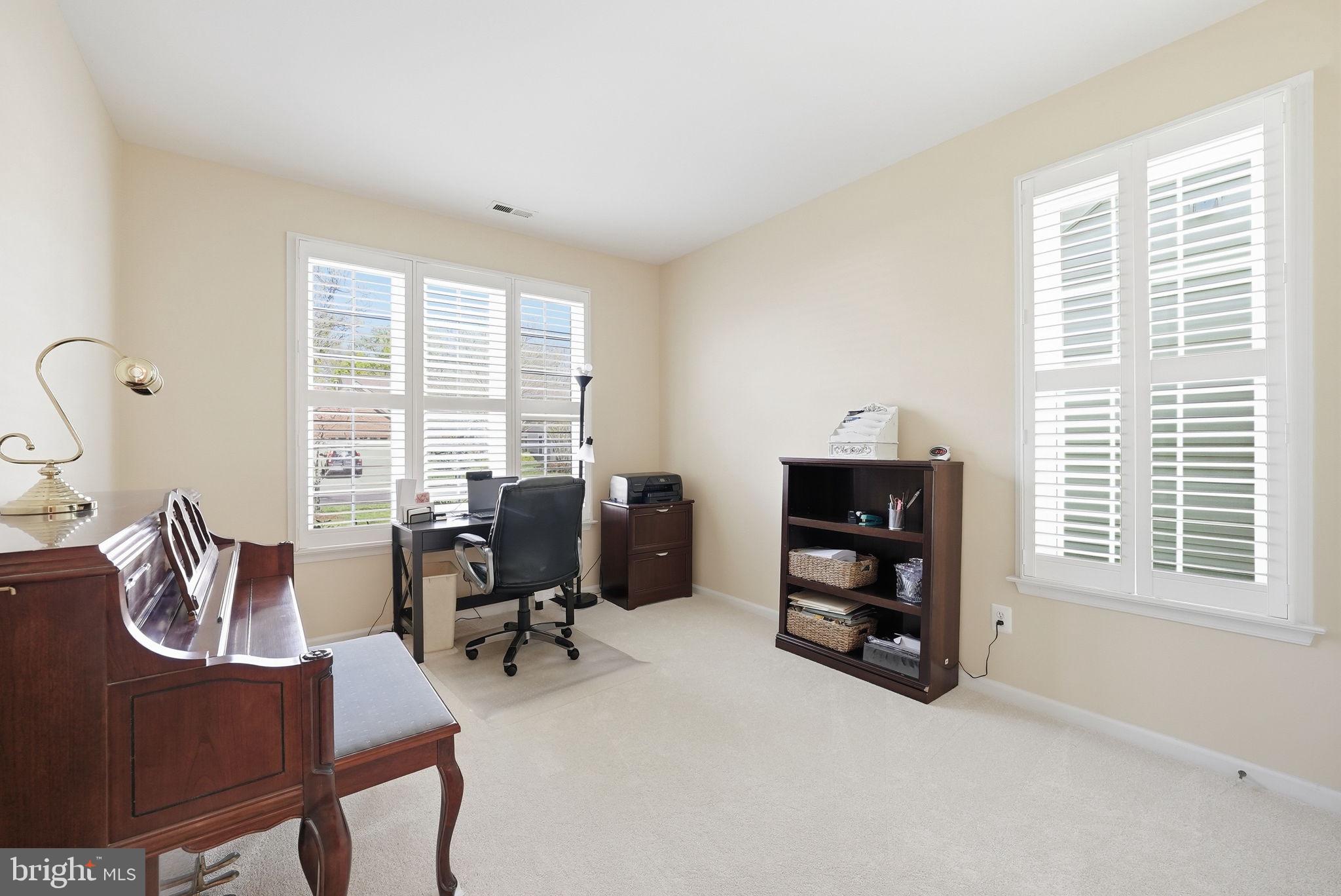 6828 Derby Run Way Gainesville, VA 20155 - Photo 19 of 30 Bright and airy home office space.
