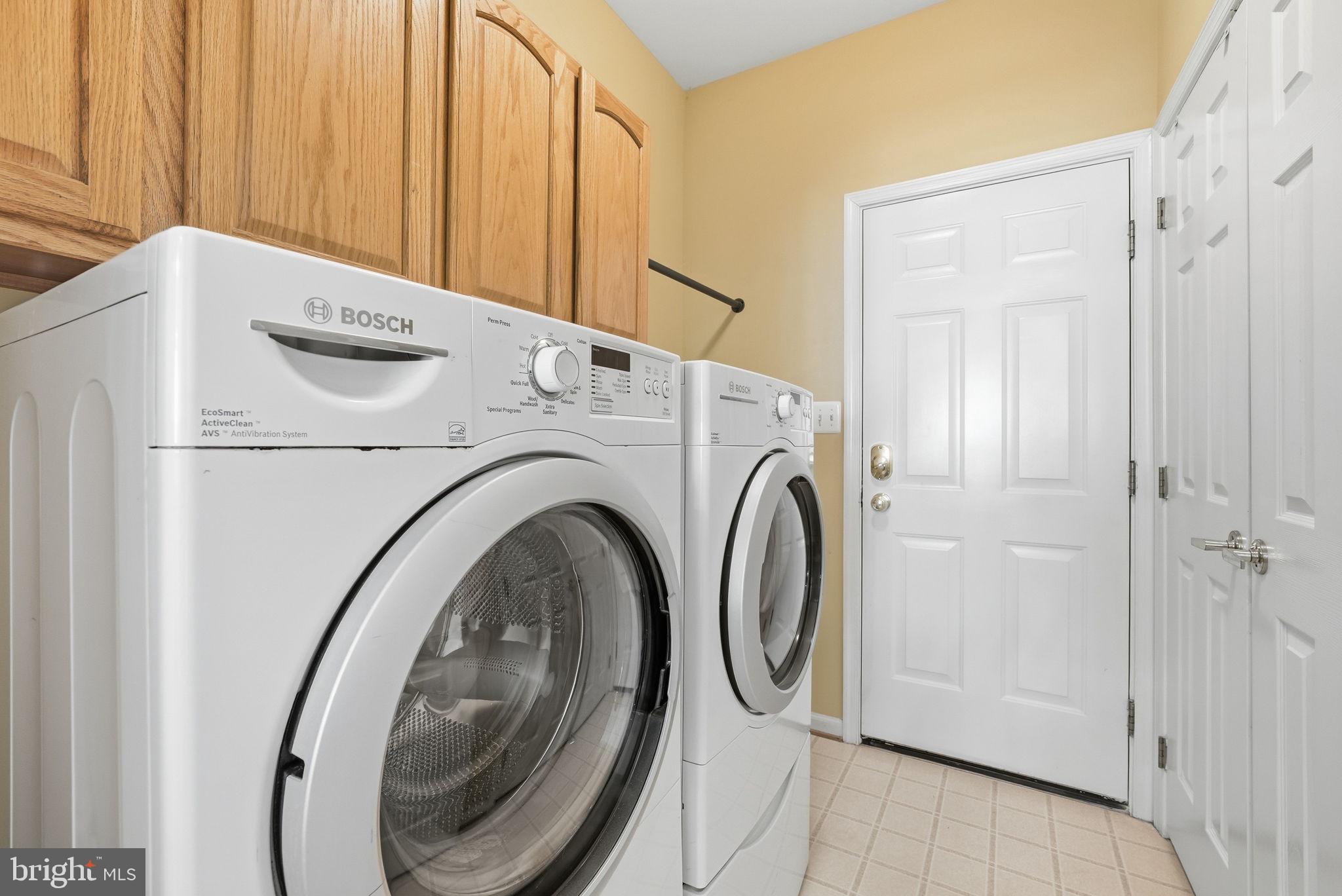6828 Derby Run Way Gainesville, VA 20155 - Photo 29 of 30 Modern laundry space with ample storage.