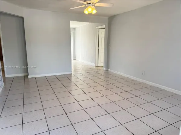 a view of an empty room and window