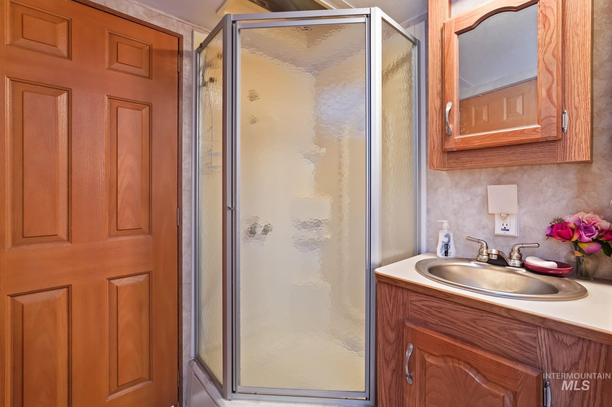 881 West Roseberry Road Donnelly, ID 83615 - Photo 24 of 24 Bathroom featuring a stall shower and vanity