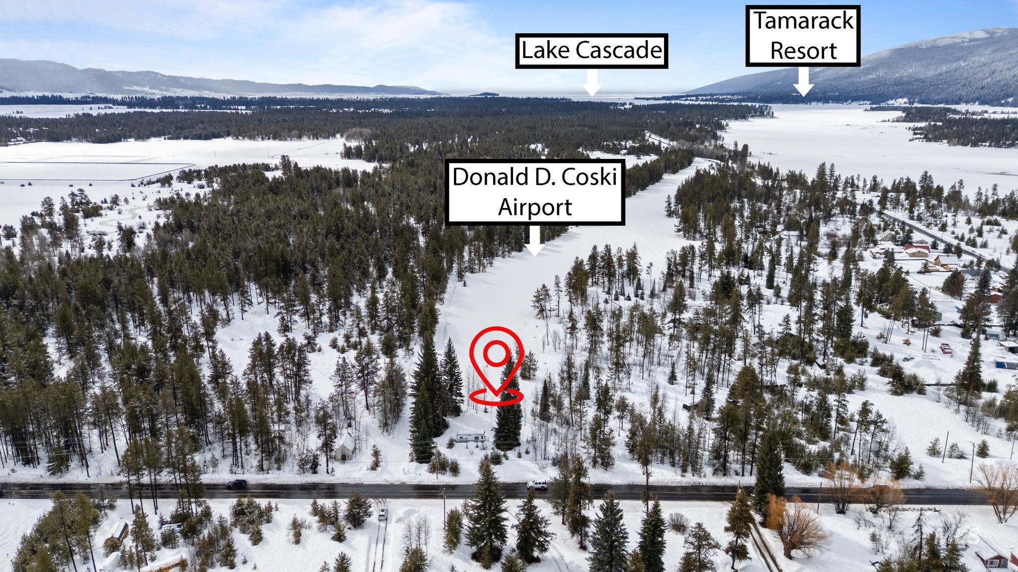881 West Roseberry Road Donnelly, ID 83615 - Photo 8 of 24 Snowy aerial view featuring a mountain view