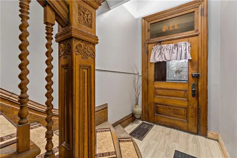 a view of a room with wooden floor and window