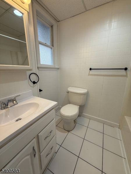 20 Orchard Street, Unit 3 Summit, NJ 07901 - Photo 6 of 6 a bathroom with a sink a toilet and mirror