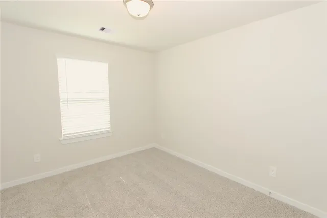 a view of a room that has a window in it