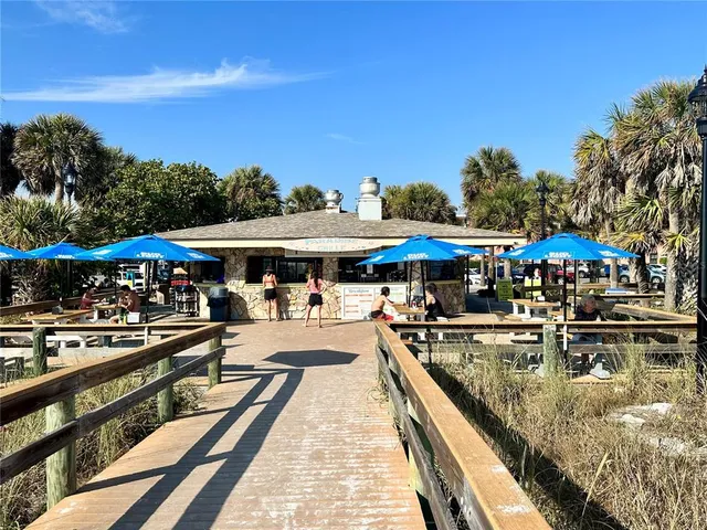 a view of a swimming pool with sitting area