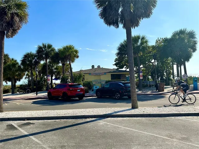a view of street with parked cars