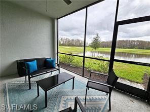 6039 Ellerston Way Avenue, Unit 2017 Immokalee, FL 34142 - Photo 13 of 34 a living room with a couch and a large window