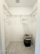 6039 Ellerston Way Avenue, Unit 2017 Immokalee, FL 34142 - Photo 20 of 34 a view of a room with racks on the wall