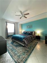 6039 Ellerston Way Avenue, Unit 2017 Immokalee, FL 34142 - Photo 6 of 34 a bedroom with a bed and a chandelier