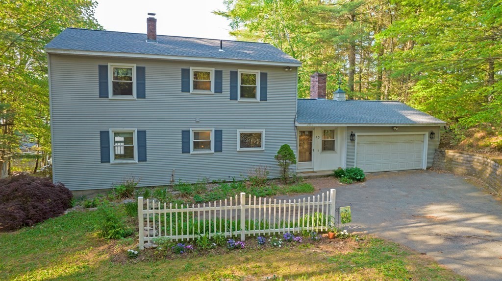 73 Beaver Road Ware, MA 01082 - Photo 3 of 42 a front view of a house with a garden