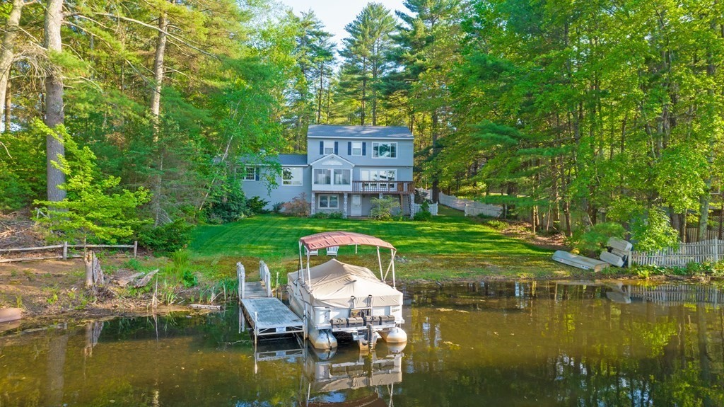 73 Beaver Road Ware, MA 01082 - Photo 4 of 42 a view of a lake with a bench in the patio