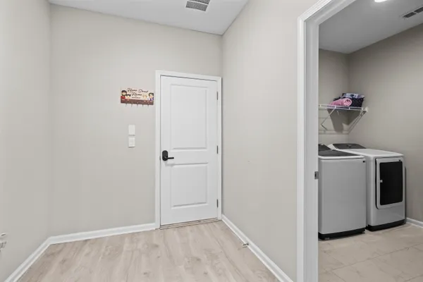 a kitchen with stainless steel appliances granite countertop a sink a stove a refrigerator and cabinets