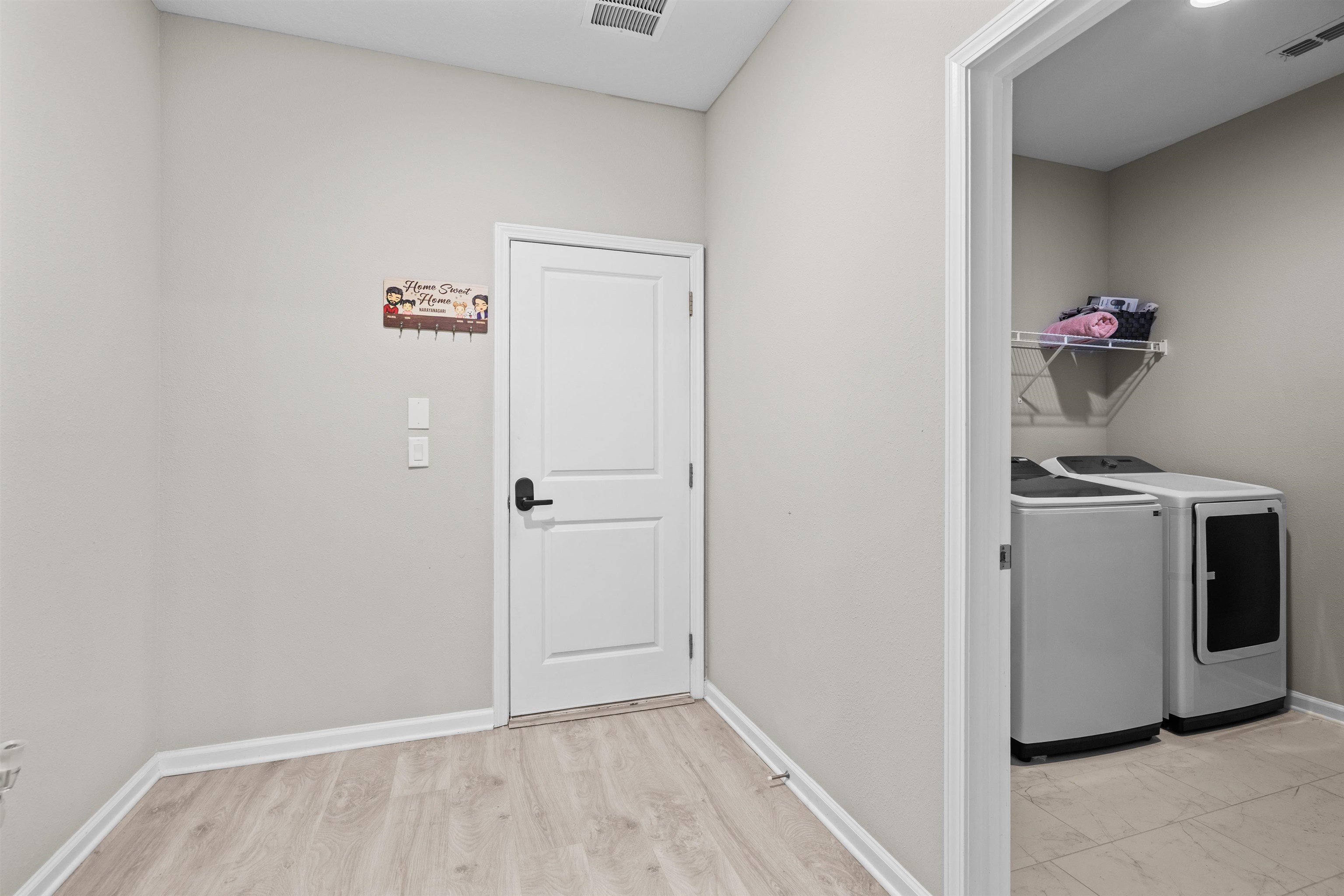 207 Archstone Way St. Augustine, FL 32092 - Photo 10 of 49 a view of storage and utility room with washer and dryer