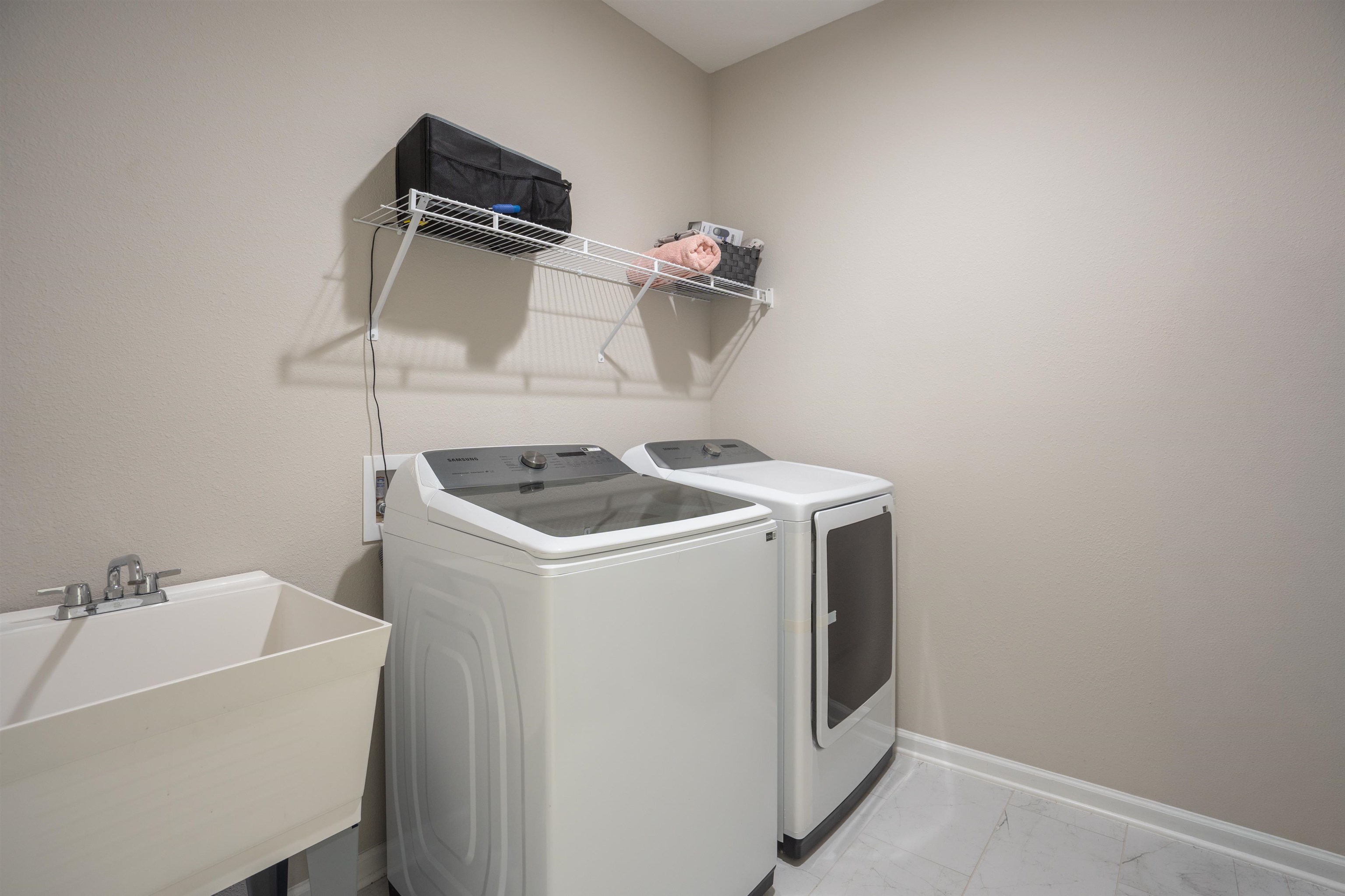 207 Archstone Way St. Augustine, FL 32092 - Photo 11 of 49 a utility room with dryer and washer