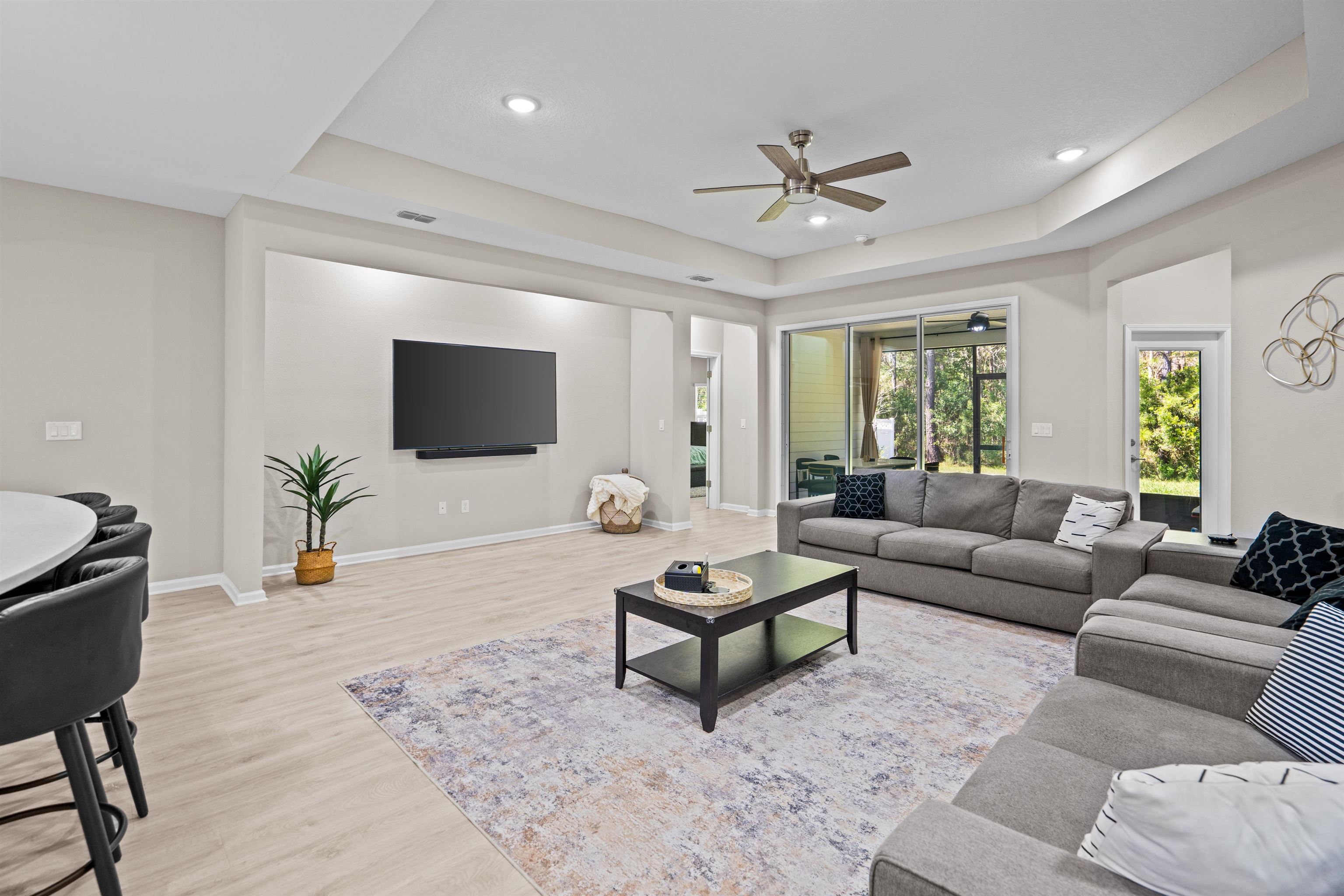 207 Archstone Way St. Augustine, FL 32092 - Photo 12 of 49 a living room with furniture and a flat screen tv