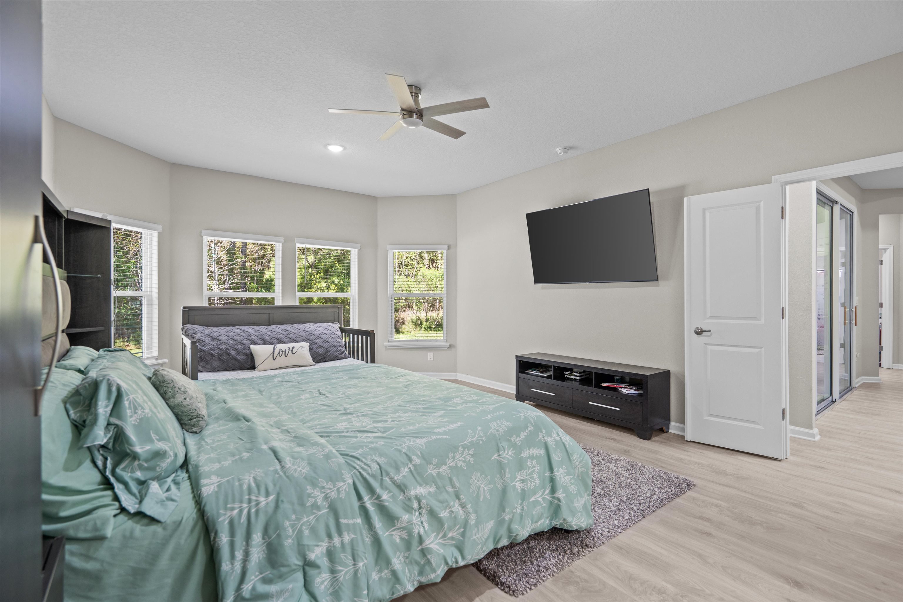 207 Archstone Way St. Augustine, FL 32092 - Photo 17 of 49 a bedroom with a bed and a flat screen tv