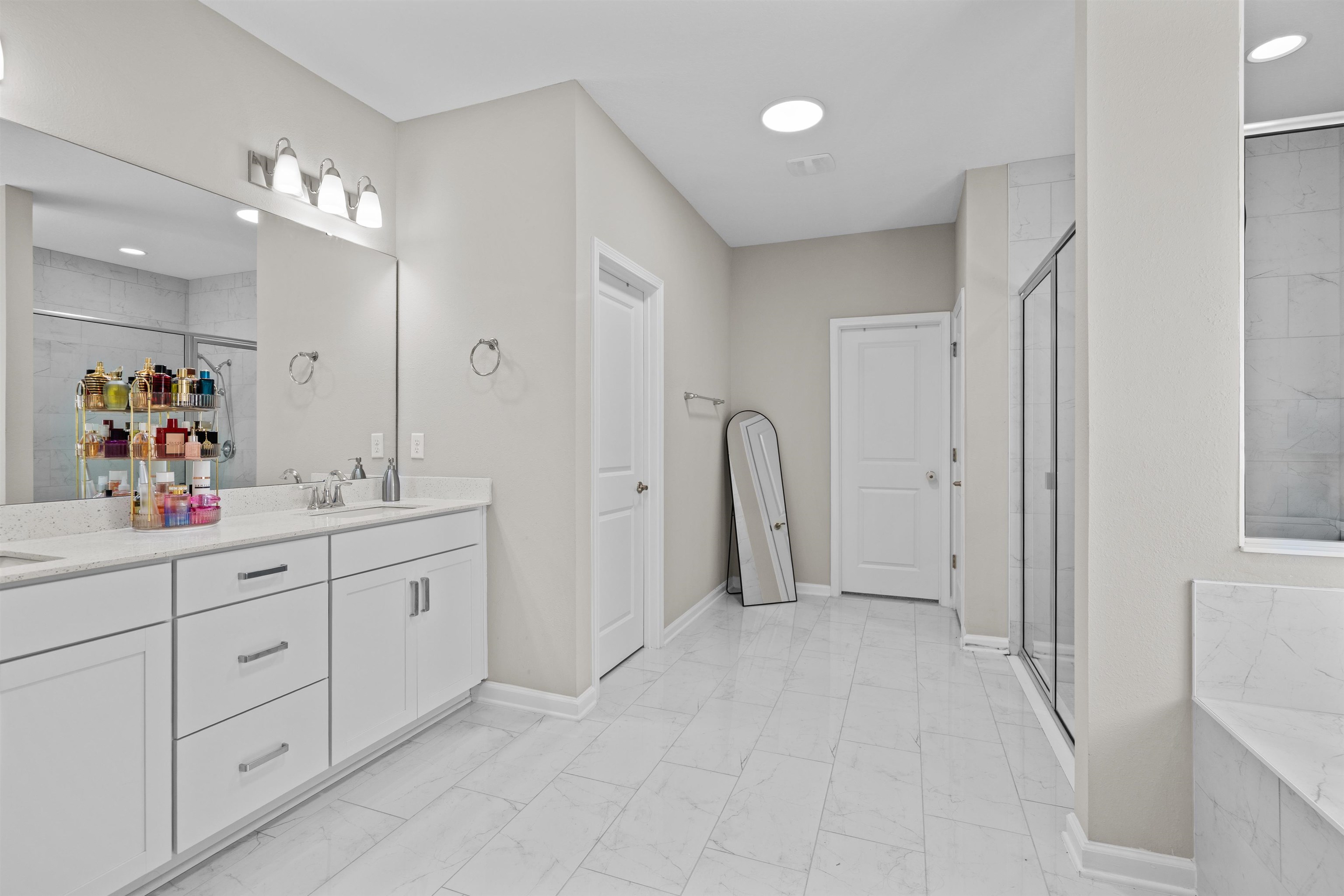 207 Archstone Way St. Augustine, FL 32092 - Photo 19 of 49 a spacious bathroom with mirror and shower