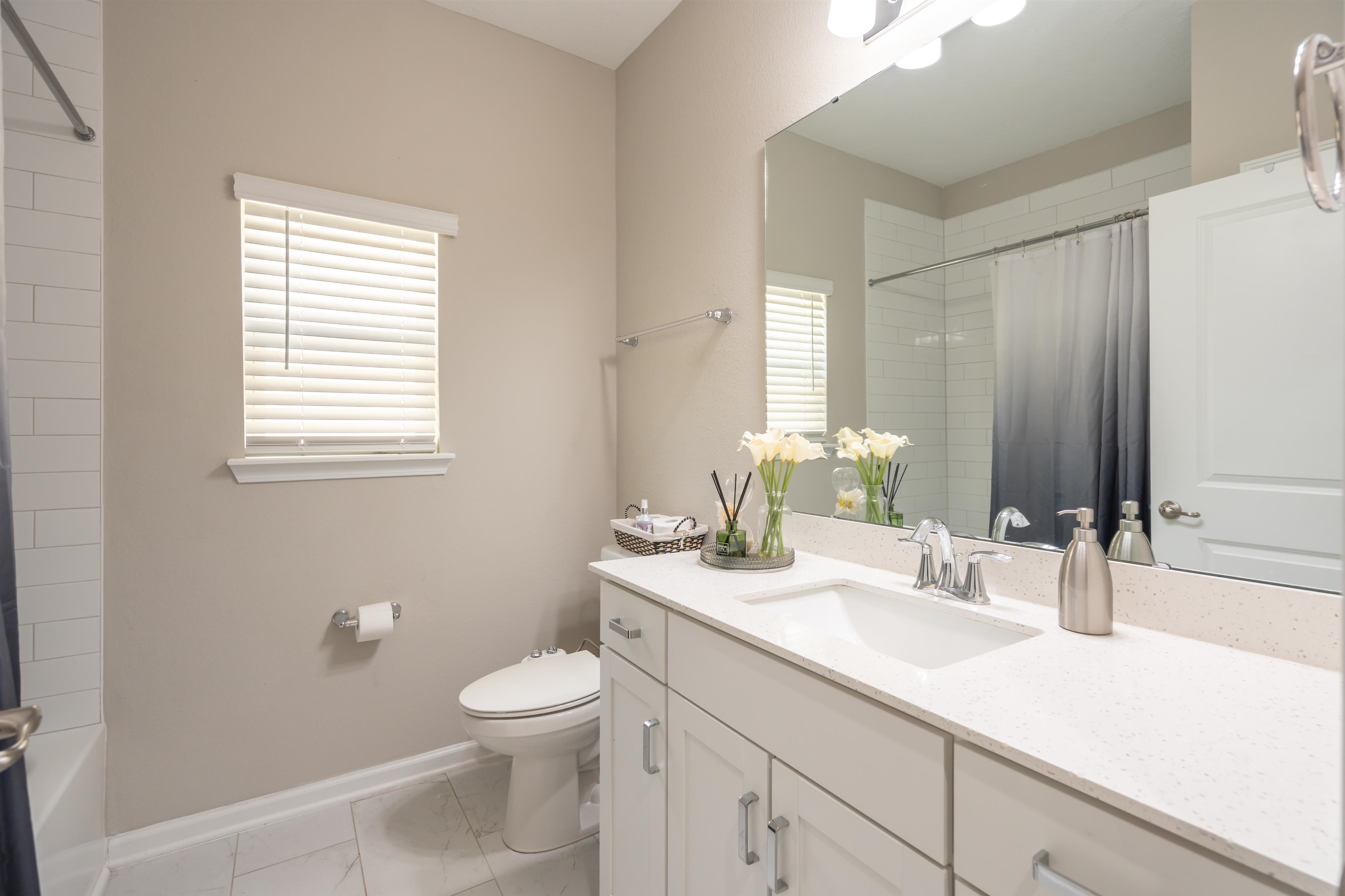 207 Archstone Way St. Augustine, FL 32092 - Photo 23 of 49 a bathroom with a toilet a sink a mirror and a window
