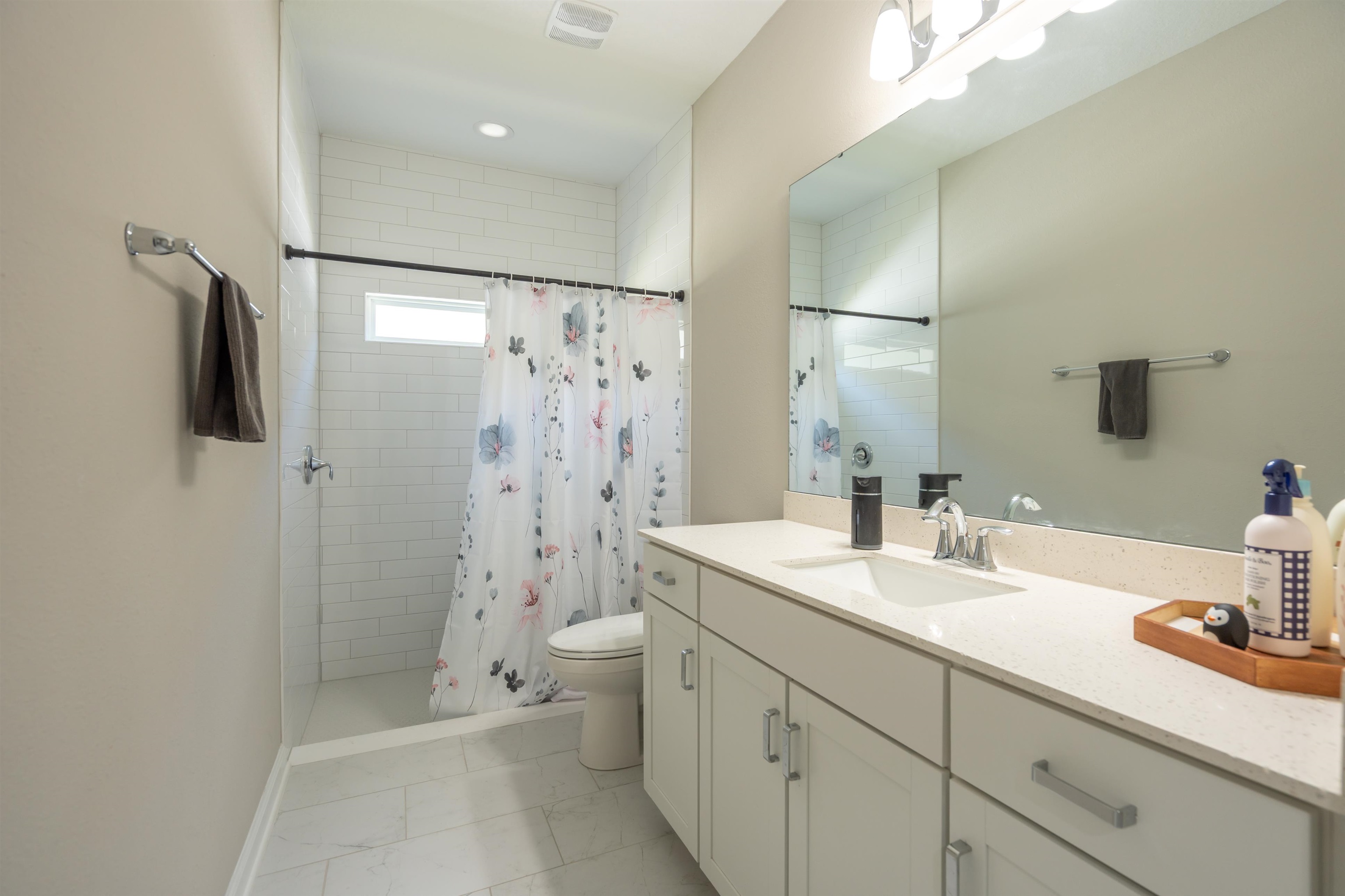 207 Archstone Way St. Augustine, FL 32092 - Photo 26 of 49 a bathroom with a double vanity sink toilet and shower
