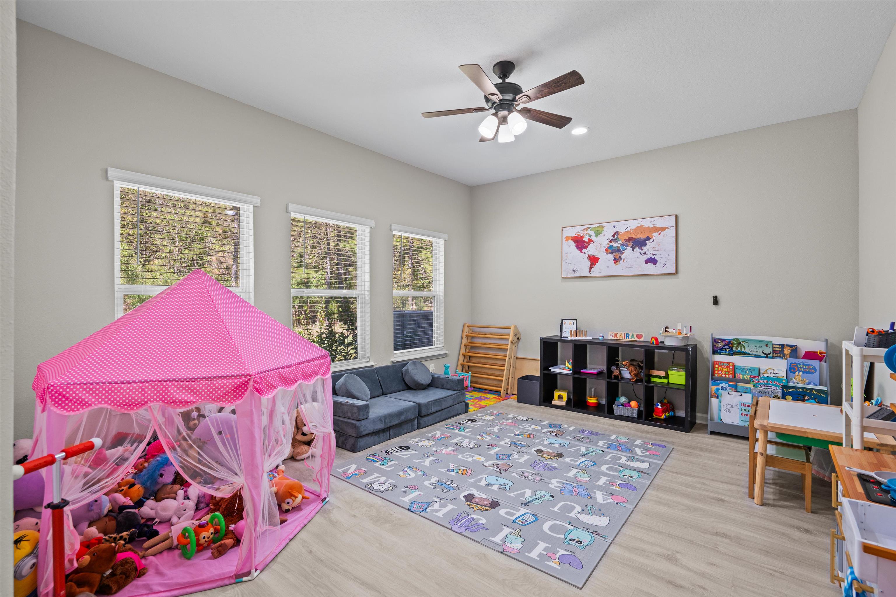 207 Archstone Way St. Augustine, FL 32092 - Photo 27 of 49 a bedroom with a bed and a chandelier