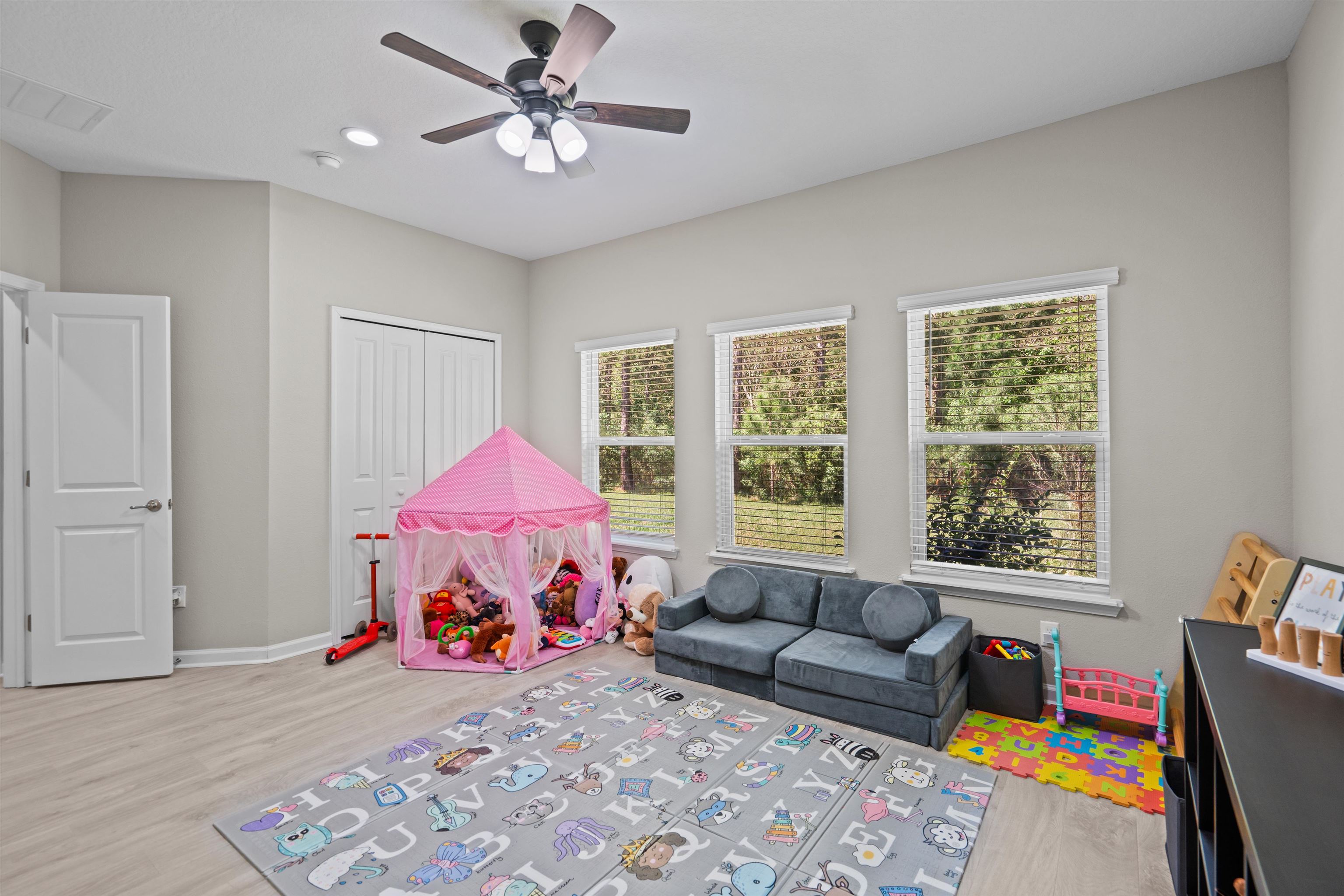 207 Archstone Way St. Augustine, FL 32092 - Photo 28 of 49 a living room with a couch and a window