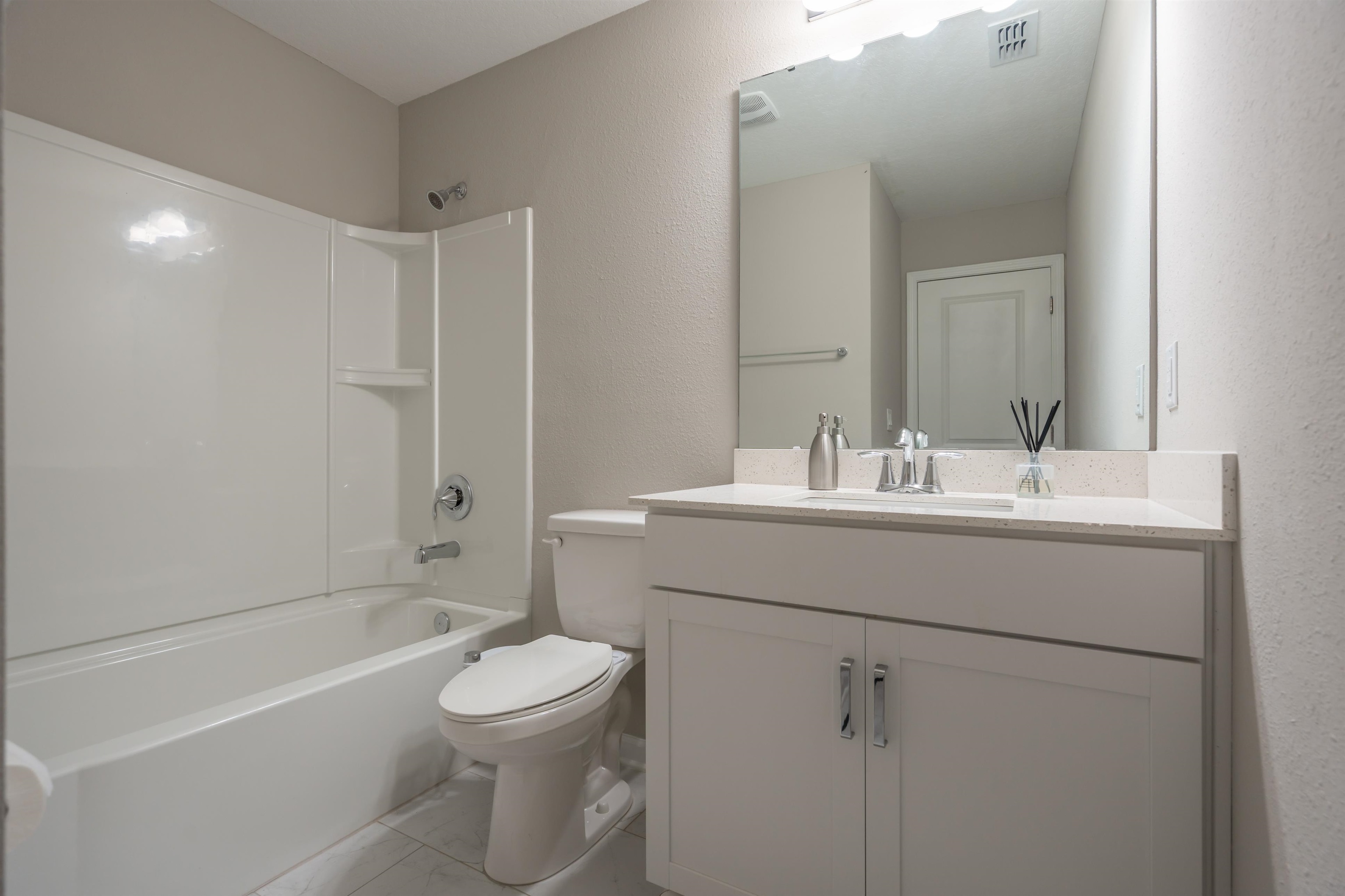 207 Archstone Way St. Augustine, FL 32092 - Photo 31 of 49 a bathroom with a sink a toilet and shower