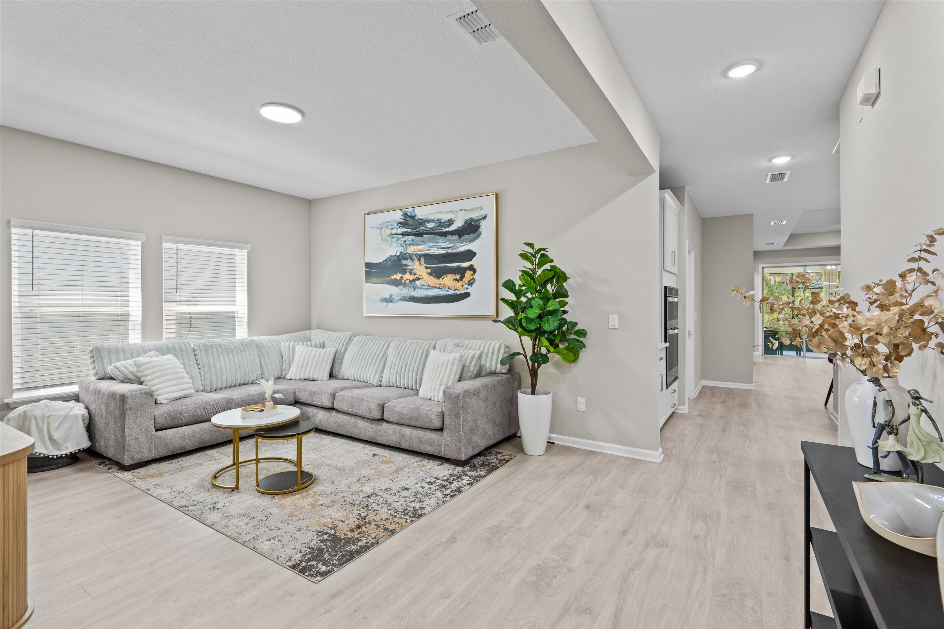 207 Archstone Way St. Augustine, FL 32092 - Photo 6 of 49 a living room with furniture and a large window