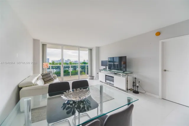 a living room with fireplace furniture and a flat screen tv