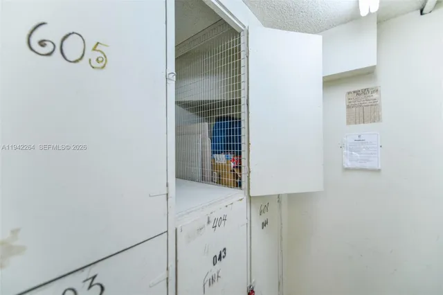 a room with gym equipment and a large window