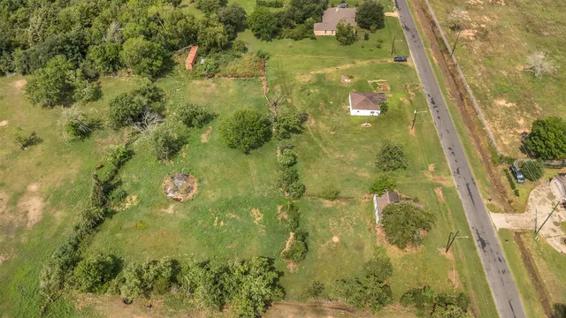 a view of a house with a big yard