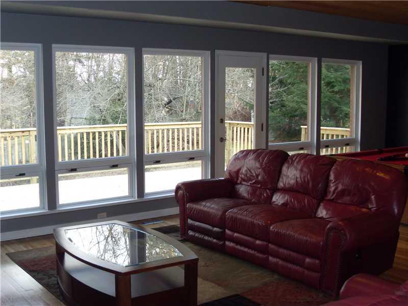 9600 Woodcrest Road Pittsburgh, PA 15237 - Photo 3 of 15 Living Room. The wall of windows and glass door leads to the new deck.