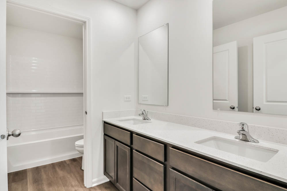 313 Snowdrop Lane Elgin, IL 60124 - Photo 14 of 61 a bathroom with a sink and a toilet