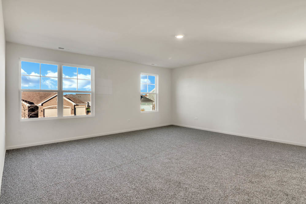 313 Snowdrop Lane Elgin, IL 60124 - Photo 18 of 61 an empty room with windows and ceiling fan