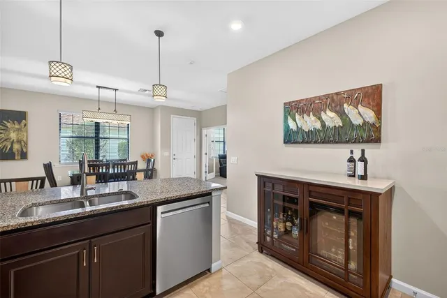 a kitchen with sink stove and microwave