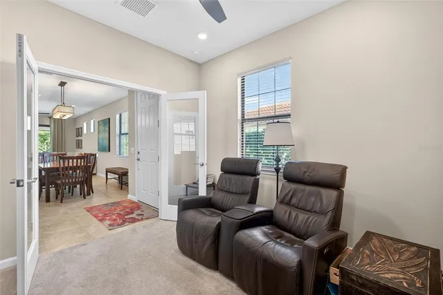 a living room with furniture and a window