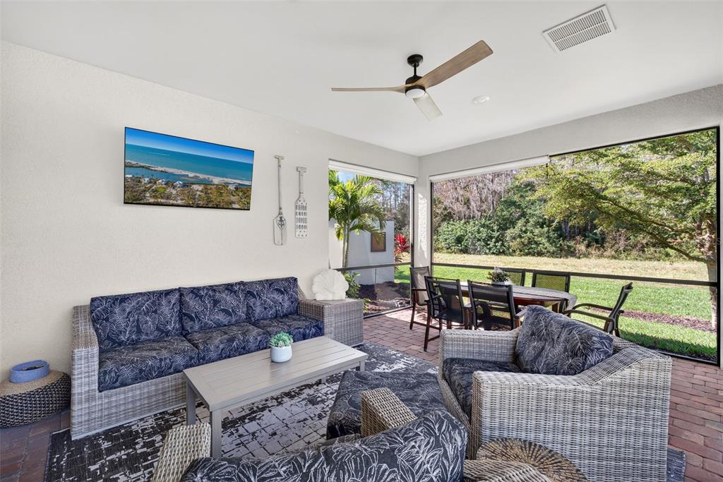 5821 Mayflower Way Ave Maria, FL 34142 - Photo 25 of 36 a living room with furniture and a large window