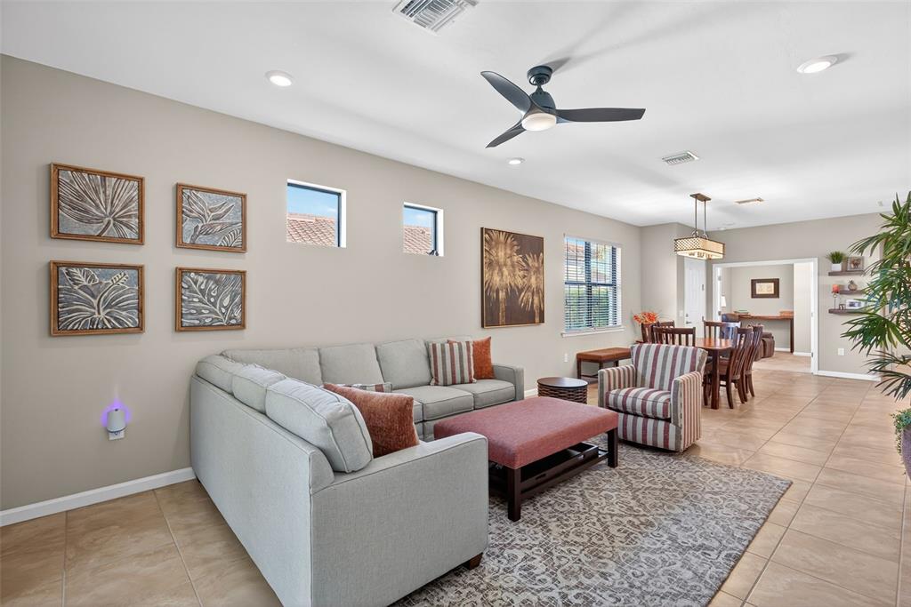 5821 Mayflower Way Ave Maria, FL 34142 - Photo 5 of 36 a living room with furniture wooden floor and window