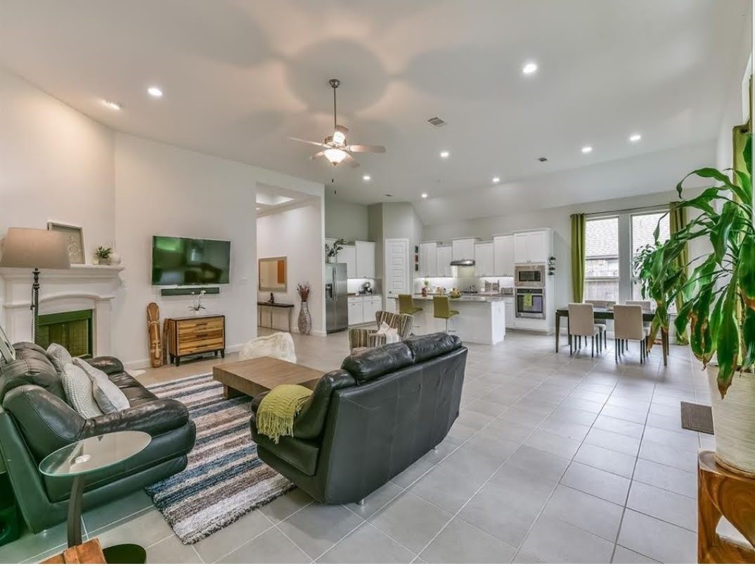 13326 Lake Chesdin Road Houston, TX 77044 - Photo 11 of 23 a living room with fireplace furniture and a wooden floor