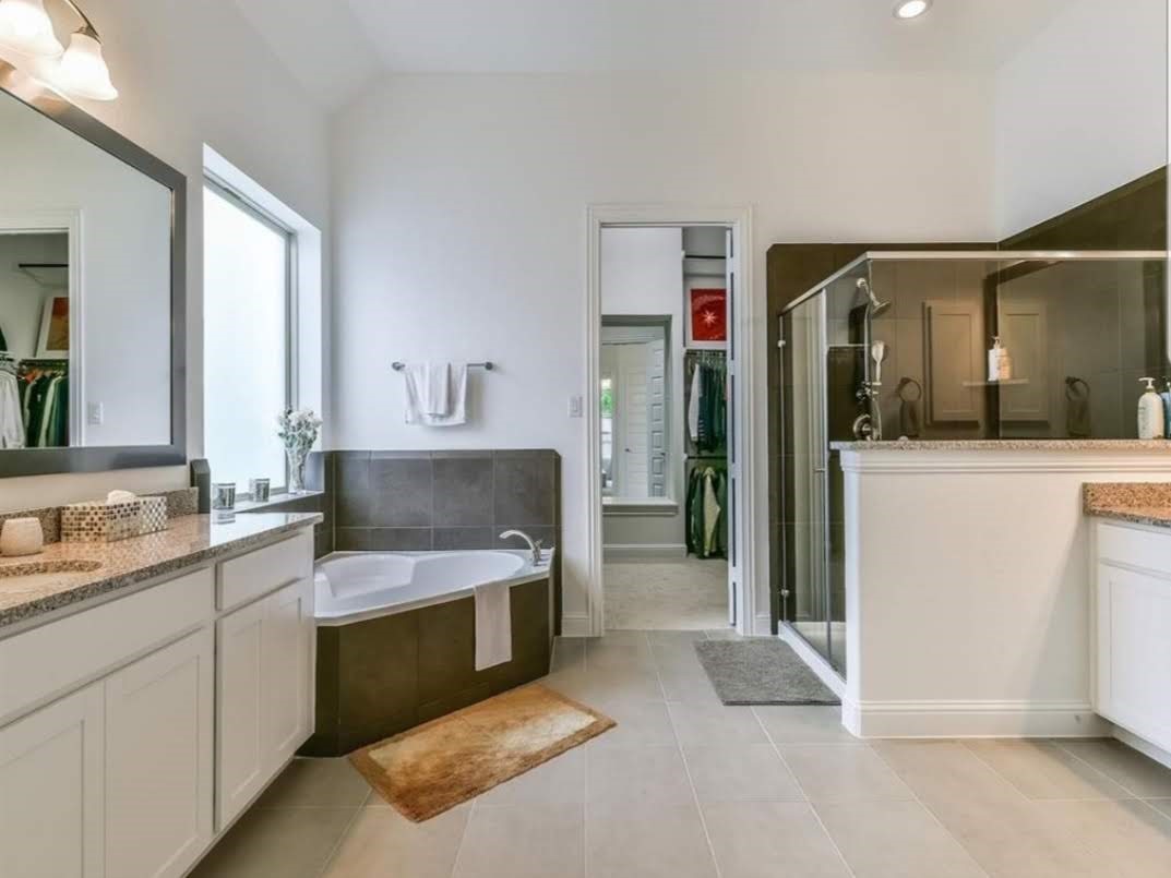 13326 Lake Chesdin Road Houston, TX 77044 - Photo 15 of 23 a spacious bathroom with a granite countertop sink and a mirror